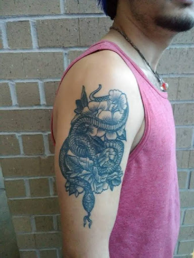 Explore deaf tattoo ideas, creative tattoo ideas in Ozark, available at Tooth & Nail Tattoo & Piercing