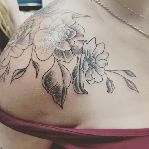 Explore book lovers tattoo ideas, creative tattoo ideas in Buford, available at Wild Tribe Tattoos and Piercings
