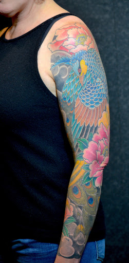 Explore rip neck tattoo ideas, creative tattoo ideas in Green Bay, available at Katana Tattoo