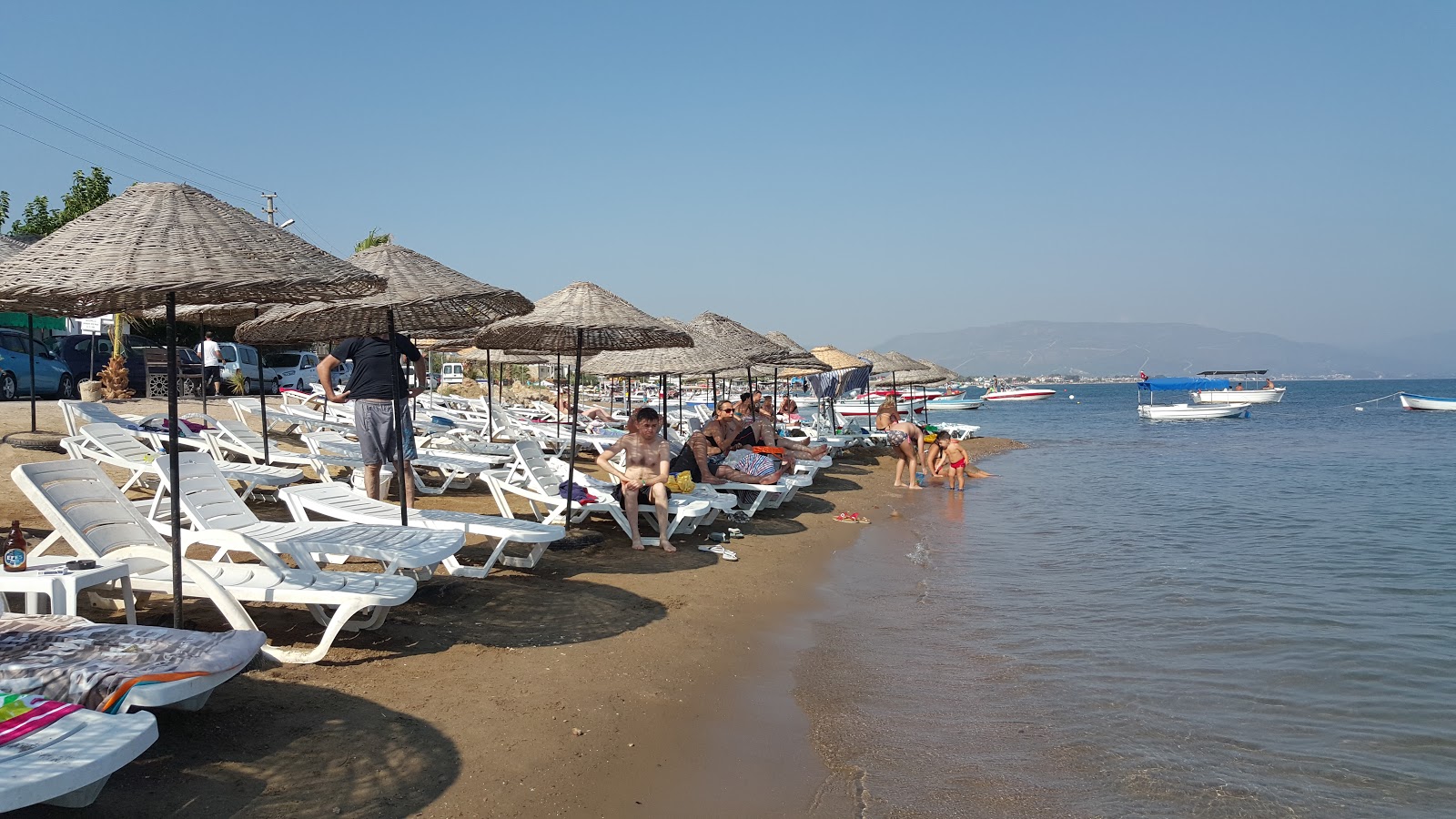 Foto de Sakiz Agaci Plaji con arena beige superficie