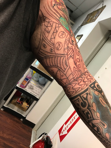 Explore lower sleeve tattoo ideas, creative tattoo ideas in Seymour, available at American Gypsy Tattoo Corp.