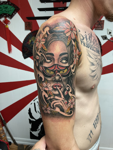 Explore axe tattoo ideas, creative tattoo ideas in Owosso, available at Expressions Body Art Studio