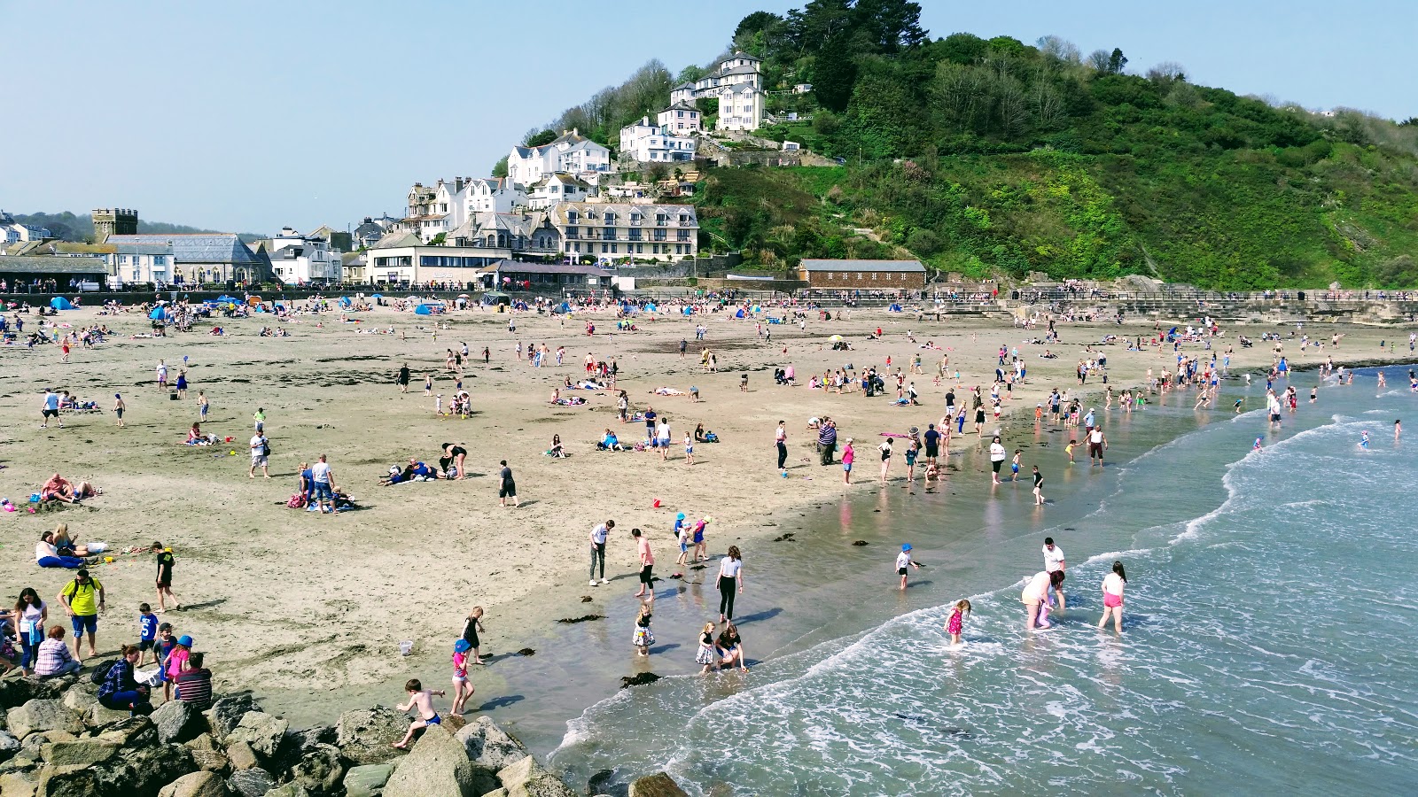 Photo of Looe beach backed by cliffs