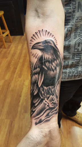 Explore leg tattoo ideas male, creative tattoo ideas in East Freedom, available at Midnight Ink Tattoo Parlor