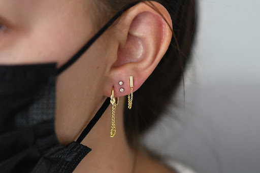 Find charm bracelet tattoo ideas for your next unique tattoo in North Aurora at Skynn