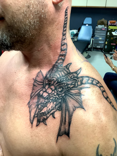 Explore black male tattoo ideas, creative tattoo ideas in Turner, available at Heathen Ink