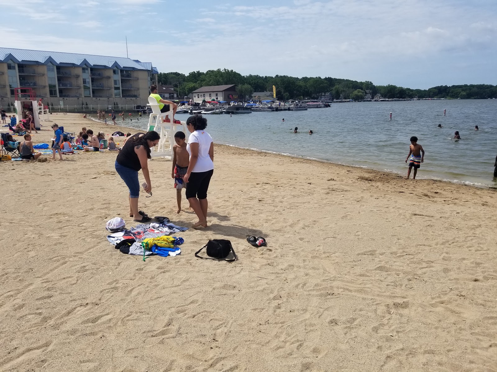 Photo of Pewaukee Beach with turquoise pure water surface