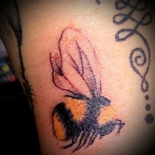 Explore thigh tattoo ideas for females, creative tattoo ideas in Nevada, available at Generation X Tattoos and Piercings