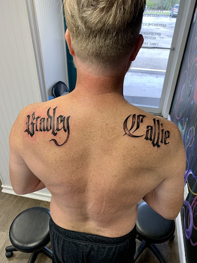 Explore neck word tattoo ideas, creative tattoo ideas in Lake City, available at Crooked Spines Tattoo Studio