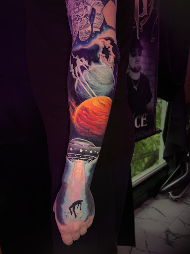 Explore cover up tattoo ideas lower back, creative tattoo ideas in Titusville, available at Exclusive Ink Studio