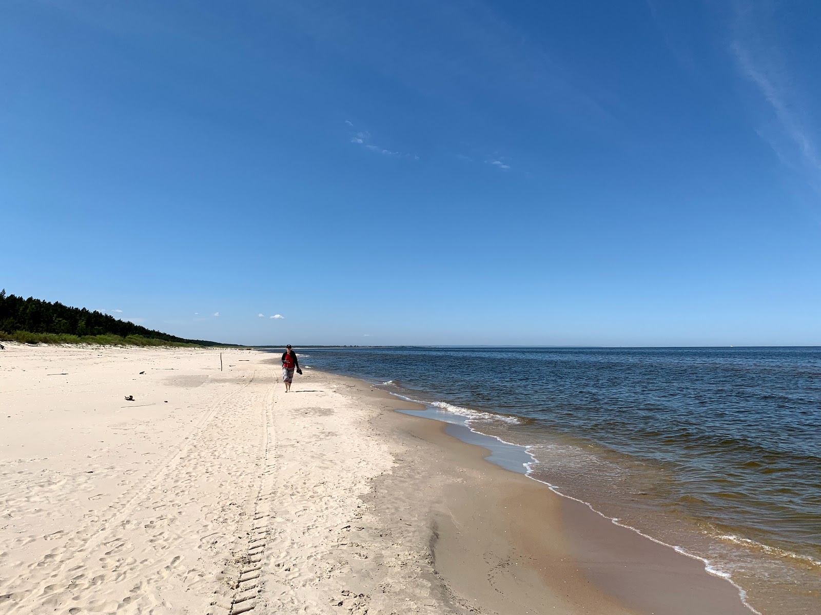 Foto af Junoszyno Beach med hvidt sand overflade