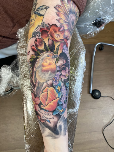 Explore upper back tattoo ideas for men, creative tattoo ideas in Denver, available at Fallen Owl Tattoo Studio