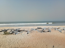 Foto de Padukere Beach com linha costeira longa e reta