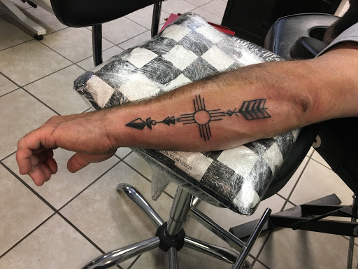 Explore wrestling tattoos ideas, creative tattoo ideas in Alamogordo, available at Southern Lights Tattoo Company