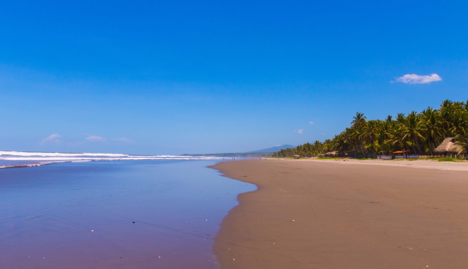 Zdjęcie Los Caracoles beach z powierzchnią szary piasek