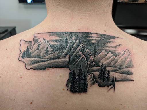 Find leg tattoo ideas for guys for your next unique tattoo in Spokane at Anchored Art Tattoo