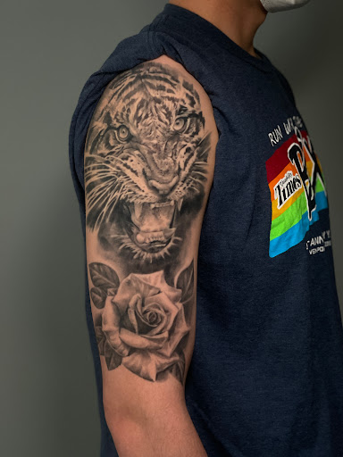 Explore snake tattoo ideas for men, creative tattoo ideas in Seattle, available at Art Never Dies Tattoo and Gallery