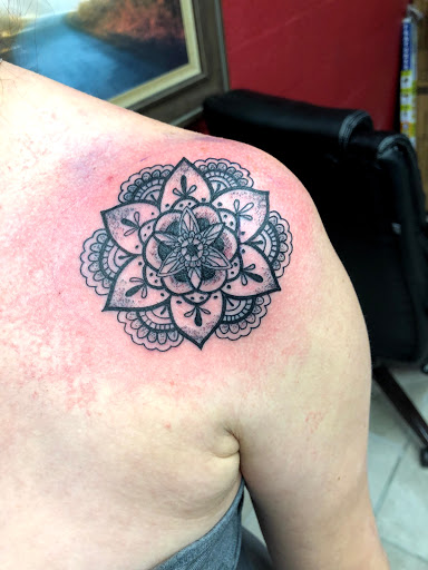 Explore neck tattoo ideas for woman, creative tattoo ideas in San Antonio, available at Twisted Tattoo