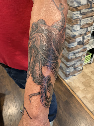 Explore flag tattoo ideas, creative tattoo ideas in Loganville, available at Blue Siren Tattoos