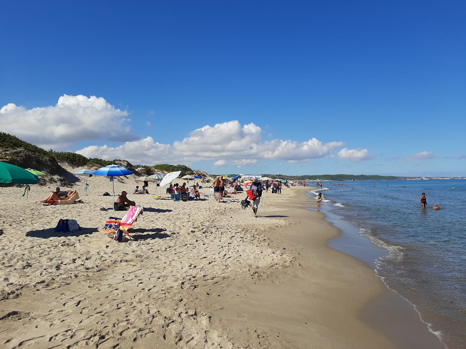 Fotografija Plaža Platamona z dolga ravna obala