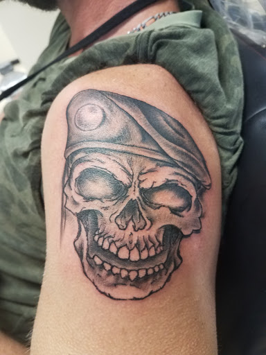 Explore half sleeve skull tattoo ideas, creative tattoo ideas in Bowling Green, available at The Mad Tatter, L.L.C.