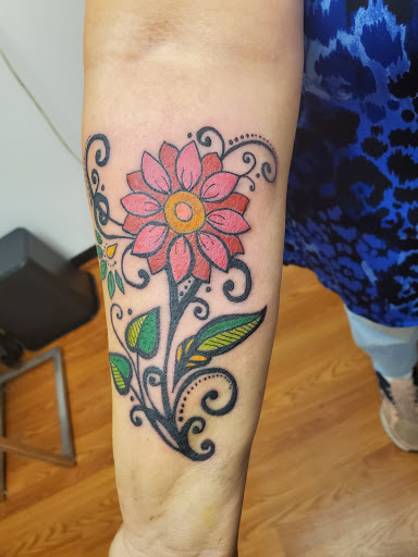 Find baby girl tattoo ideas for your next unique tattoo in Altoona at Black Dragon Tattoo
