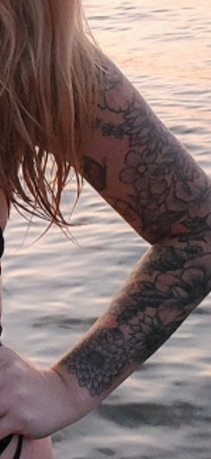 Explore female half sleeve tattoo ideas, creative tattoo ideas in Osceola, available at Crowned Raven Tattoo Inc.