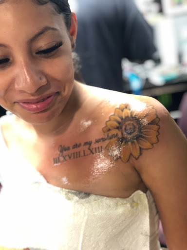 Explore biceps tattoo ideas, creative tattoo ideas in Jamaica, available at Rising Phoenix Ink