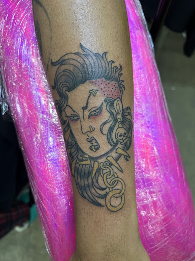 Find lion hand tattoo ideas for men for your next unique tattoo in Winter Park at Forged Empire Tattoo Studio