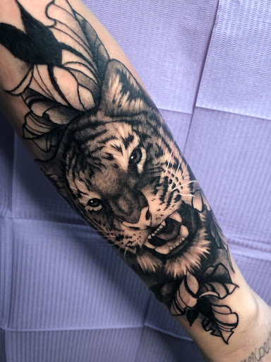Explore tattoo ideas for pets, creative tattoo ideas in Adrian, available at Ambition Ink