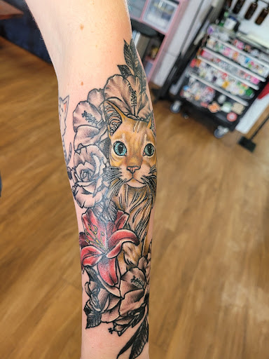 Explore highland cow tattoo ideas, creative tattoo ideas in Anniston, available at Lucid Dreams Tattoos and Piercings