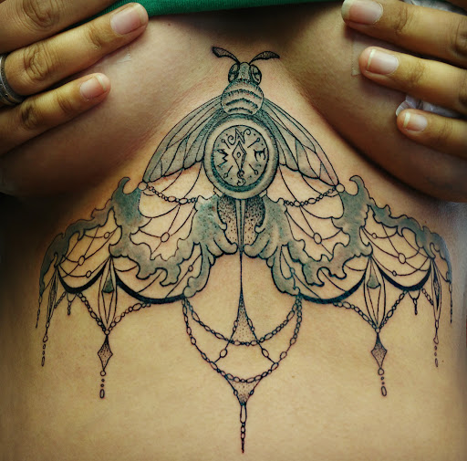 Explore small shoulder tattoo ideas, creative tattoo ideas in Groves, available at Billet Tattoo Studio