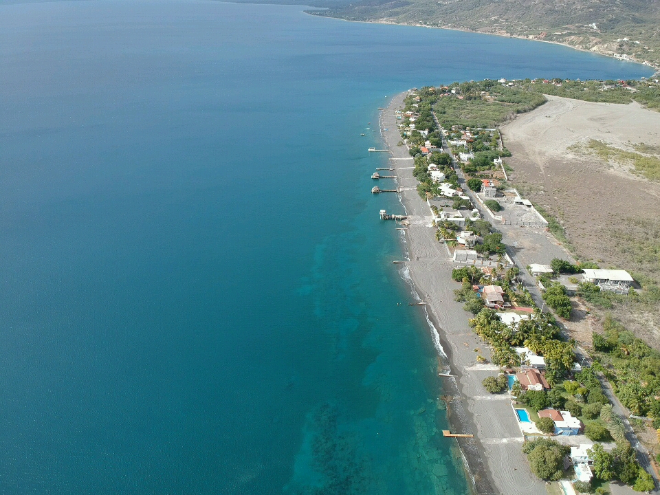 Palmar de Ocoa beach'in fotoğrafı turkuaz su yüzey ile