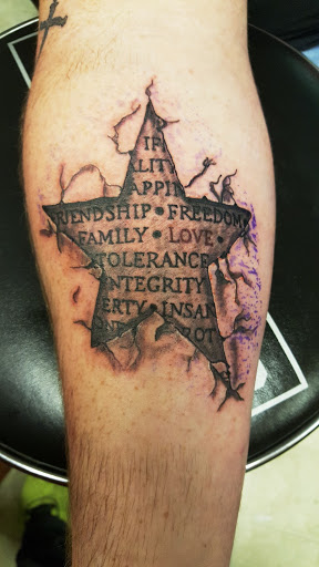 Explore last name back tattoo ideas, creative tattoo ideas in Owensboro, available at BnB Tattoos & Piercings
