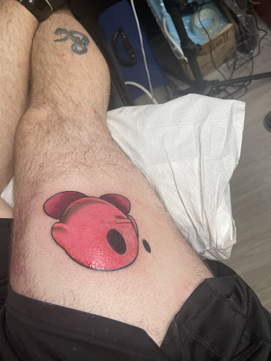 Explore rose thigh tattoo ideas, creative tattoo ideas in Providence, available at F.I.N.A.O. Ink Tattoo Company