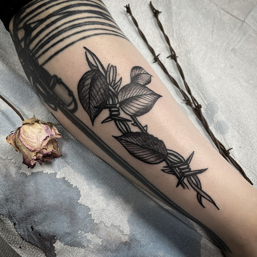 Explore newborn tattoo ideas, creative tattoo ideas in Buffalo, available at True Gloom Tattoo Studio