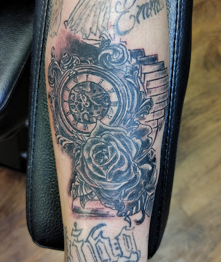 Explore black king tattoo ideas, creative tattoo ideas in Lafayette, available at DragonsBane Tattoo & Body Piercing