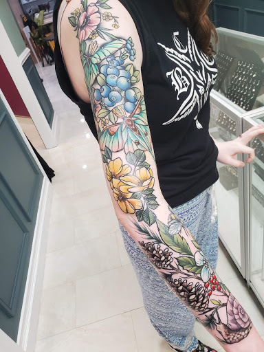 Explore arm sleeve tattoo ideas woman, creative tattoo ideas in Bay Shore, available at House Of Colour Tattoo