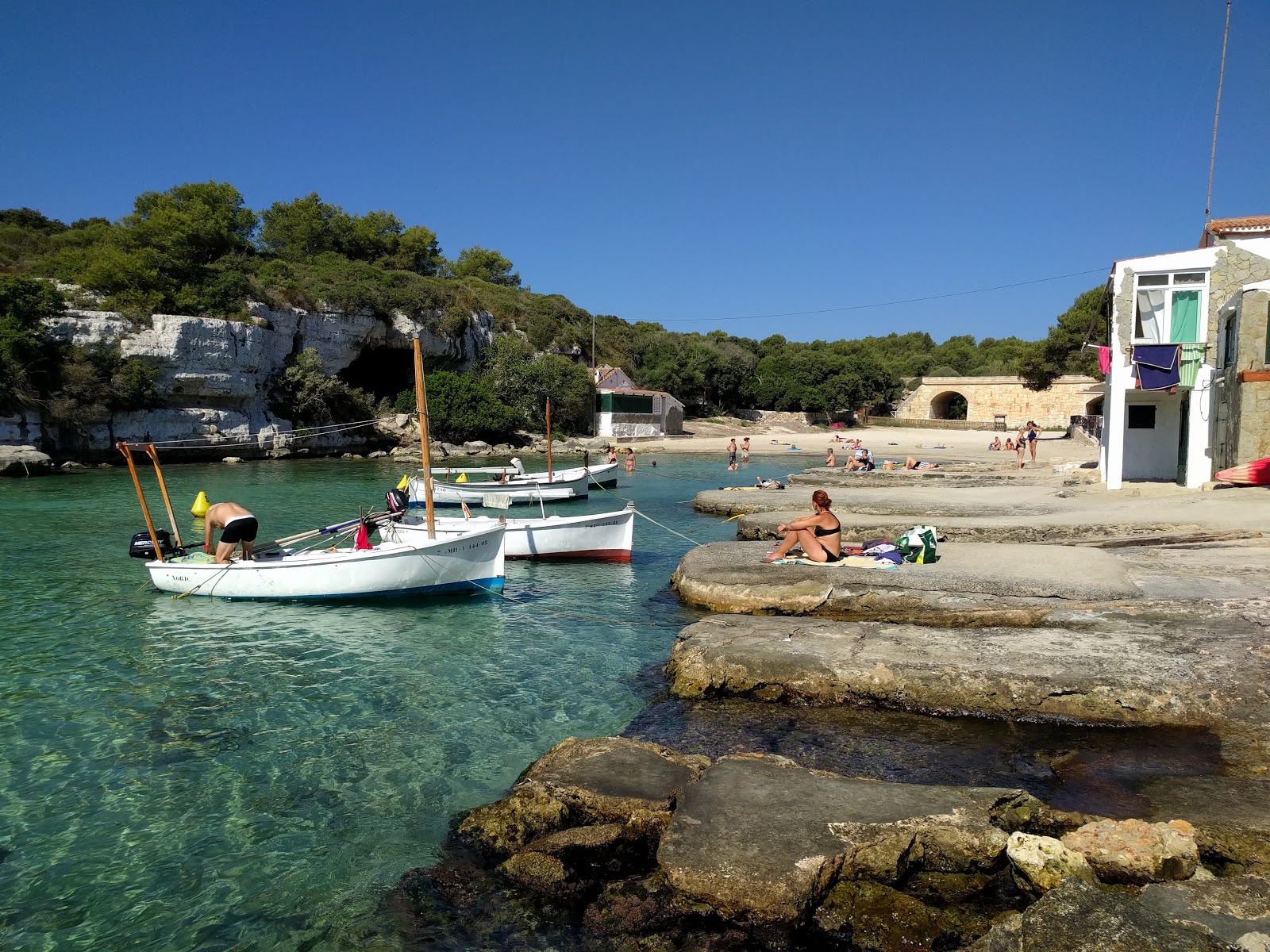Photo of Cala Alcaufar with turquoise water surface
