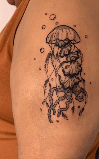 Explore tattoo ideas of strength, creative tattoo ideas in San Diego, available at Revel in Artistry