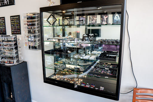 Explore spina bifida tattoo ideas, creative tattoo ideas in Summerville, available at Exotic Impressions Body Piercing