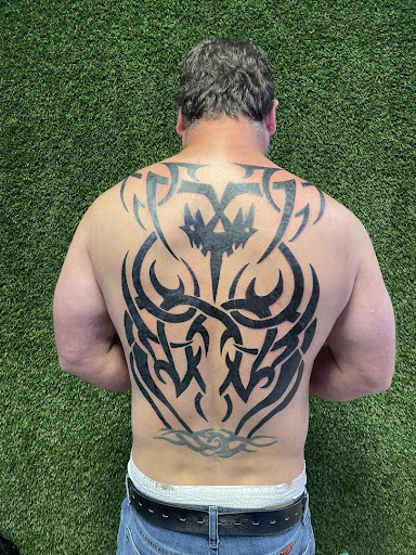 Explore green tattoo ideas, creative tattoo ideas in Cocoa, available at Rorschach Tattoo Shop and Piercing Studio