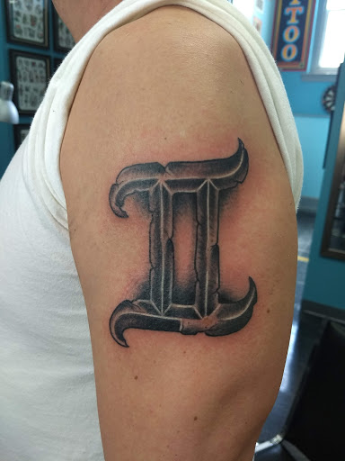 Explore armband tattoo ideas for men, creative tattoo ideas in Glenside, available at Glenside Tattoo