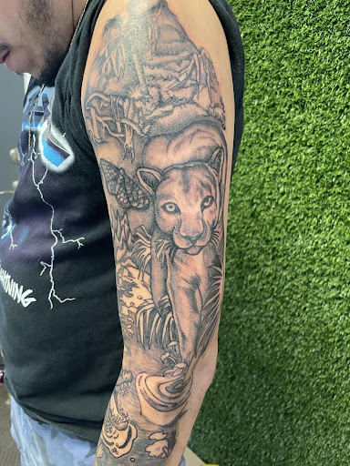 Explore badass tattoo ideas, creative tattoo ideas in Cocoa, available at Rorschach Tattoo Shop and Piercing Studio