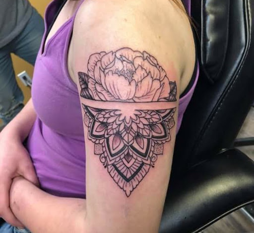Explore tattoo ideas for womens thigh, creative tattoo ideas in Ottumwa, available at Family Tradition TattoosPiercings