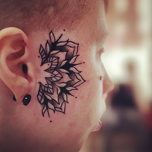 Explore death metal tattoo ideas, creative tattoo ideas in Lees Summit, available at The Cherry Bomb Tattoo Co.