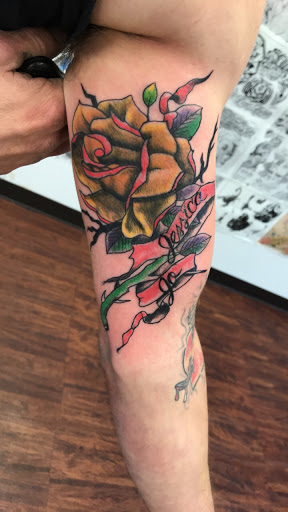 Explore love and war tattoo ideas, creative tattoo ideas in Seymour, available at American Gypsy Tattoo Corp.