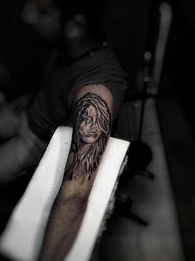 Find music tattoo ideas for men for your next unique tattoo in Lavonia at 1890 Tattoo Co.