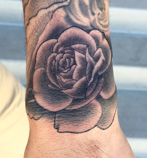 Explore feminine cross tattoo ideas, creative tattoo ideas in Reno, available at Aces Tattoo