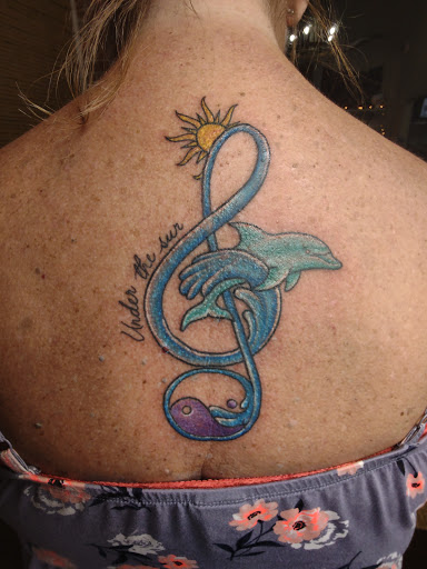 Find wolf tattoo idea for your next unique tattoo in Winter Haven at Angry Elephant Tattoos Winter Haven